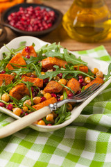 Sweet potato salad with lentils, pomegranates and rocket.