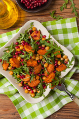 Sweet potato salad with lentils, pomegranates and rocket.