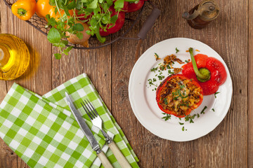 Colorful baked with cheese, stuffed peppers with rice and minced meat.