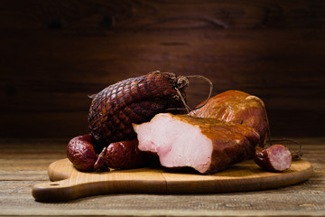 Smoked pork on wooden board.
