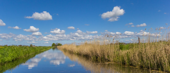 Panorama of a little river in the dutch landscape