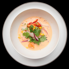 Sea bass ceviche shot from above, isolated on black