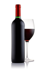 Bottle and a glass filled with red wine isolated on white background