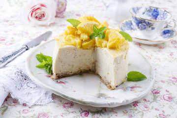 Traditional lemon cheesecake as close-up on a plate