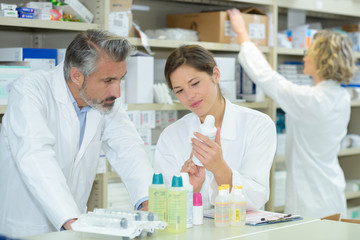 pharmacist inspecting the products