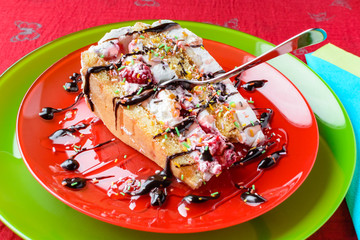 Piece of cake with mixed fruits and tasty decoration