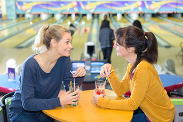 girls meeting at a bowling center