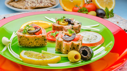 Cold appetizer. Tuna medallions with selection of fruits and vegetables