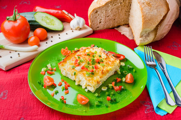 Cauliflower with cheese and vegetables baked in the oven