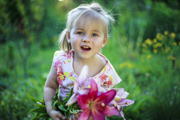 Beautiful white girl with a smile and a bouquet of flowers