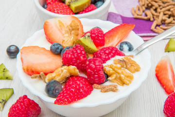 breakfast with yogurt,strawberry rasperry and cereals 