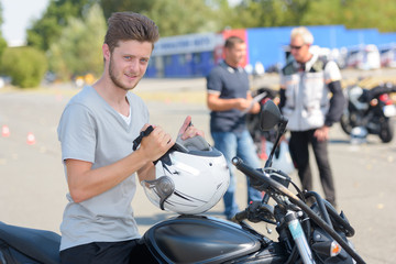 young confident boy doing a test motorbike