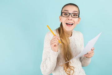 Attractive woman with ponytail and paper sheet