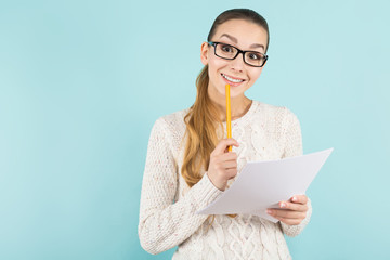 Attractive woman with ponytail and paper sheet