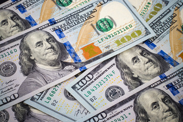 New one hundred dollar bills background with vignette effect