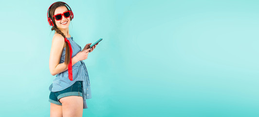 Young sexy woman with headphones and cellphone