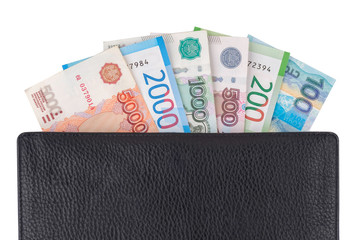 Currency russian rubles, banknotes 100, 200, 500, 1000, 2000, 5000, in leather wallet, isolated on white.