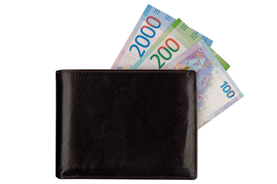 Currency new rubles, banknotes nominal 100, 200, 2000 in wallet, isolated on white.