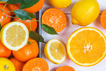 Fresh  citrus fruits background flat lay, healthy lifestyle vegetarian organic antioxidant detox diet beverage. Tropical summer assortment grapefruit, orange, lemon,tangerines