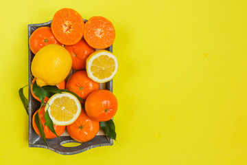 Fresh  citrus fruits background flat lay, healthy lifestyle vegetarian organic antioxidant detox diet beverage. Tropical summer assortment grapefruit, orange, lemon,tangerines