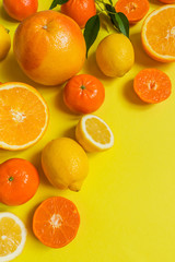 Fresh  citrus fruits background flat lay, healthy lifestyle vegetarian organic antioxidant detox diet beverage. Tropical summer assortment grapefruit, orange, lemon,tangerines