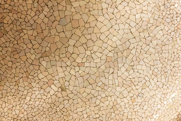 Ceramic tiles background, broken glass mosaic, decoration in Park Guell, Barcelona, Spain. Designed by Gaudi - obrazy, fototapety, plakaty