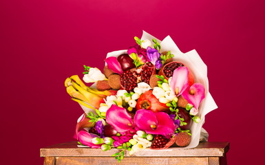 Flowers, fruit bouquet, pink callas, garnet, lychees, freesia, pitahaya