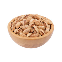 Almond in wooden bowl isolated on white. Side view.