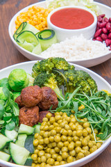 vegan dish with rice, vegetables and soy meatballs