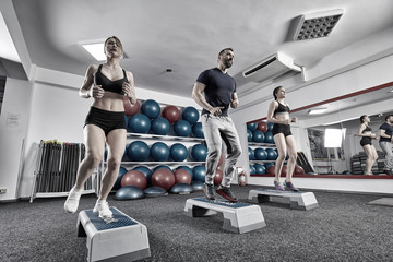 Fitness trainer with women doing cardio