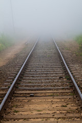 Fototapeta na wymiar Mist covering railway tracks near Haputale, Sri Lanka