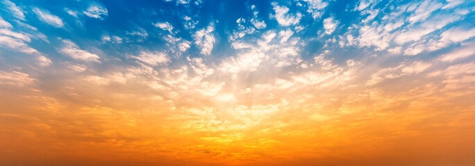 Naklejka na ściany i meble Panorama background of cloudy blue and orange sky