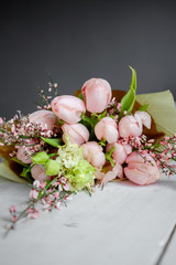 Bouquet of pink tulips on the table