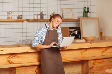 Joyful hard working woman focusing on work