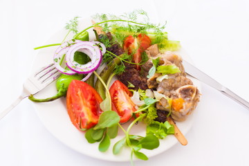 Food. Plate:  tomato, pepper, meat, leaves greenery, lamb