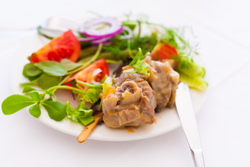 Food. Plate:  tomato, pepper, meat, leaves greenery, lamb