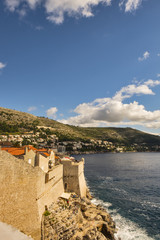Fototapeta na wymiar Dubrovnik old city fortress, Old Town walls and Lokrum island in background. Croatia 