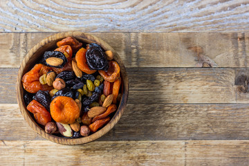 Fototapeta na wymiar Mix from dried fruits and nuts in bowl