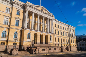 Fototapeta na wymiar HELSINKI, FINLAND - AUGUST 24, 2016: Yellow colored columned Government Palace on the Senate Square in Helsinki