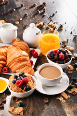 Breakfast served with coffee, juice, croissants and fruits