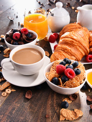 Breakfast served with coffee, juice, croissants and fruits