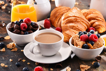 Breakfast served with coffee, juice, croissants and fruits