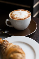 Food. Cappuccino and croissant