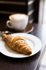 Food. Cappuccino and croissant