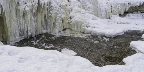 Fototapeta na wymiar Frozen river at the winter day