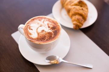 Food. Cappuccino and croissant