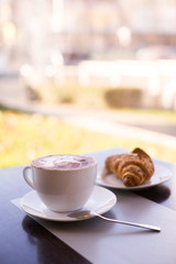 Food. Cappuccino and croissant