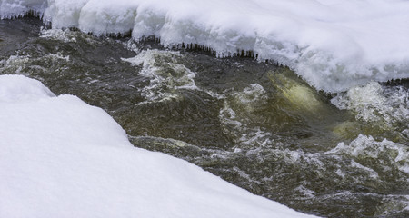 Frozen river at the winter day
