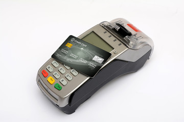 Credit debit card on top of reader machine isolated