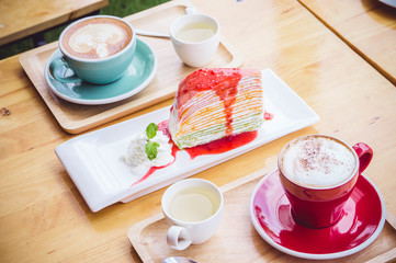 coffee red cup cappuccino and cake on table